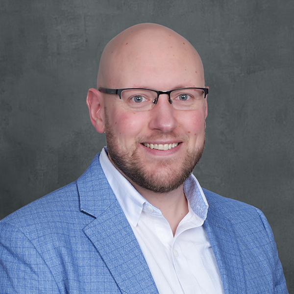 Smiling man in blue blazer