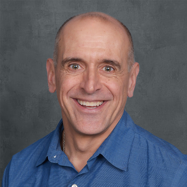 Smiling man in blue shirt