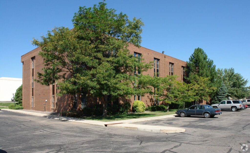 Brick building surrounded by trees